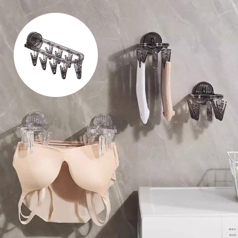 Suction cup folding clothes hanger with clip